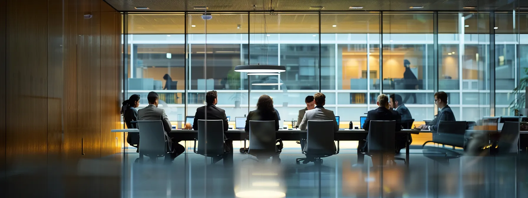 a group of professionals reviewing and discussing security protocols and compliance standards in a modern office meeting room.